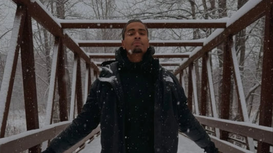 guy standing on bridge